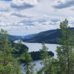 Views from above a lake, with mountains in the background